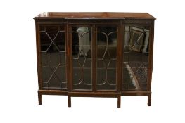 An early 20th century mahogany break front display cabinet.