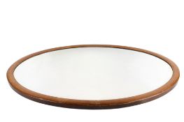 An early 20th century bevelled edge wall mirror. Of oval form, the frame with inlaid decoration, 63.