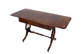 A 20th century mahogany drop leaf table.