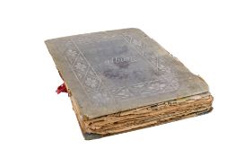 An early 20th century postcard and scrap album.