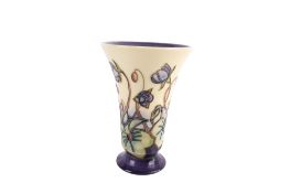 A Moorcroft Ashwood Hepatica pattern vase designed by Emma Bossons.