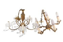 A pair of French five-arm crystal chandeliers.
