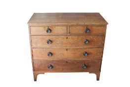 A vintage oak chest of drawers.
