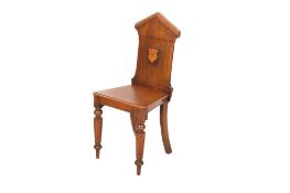 A Victorian oak hall chair.