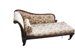 A Victorian carved rosewood chaise longue. Raised on turned tapering supports with casters.