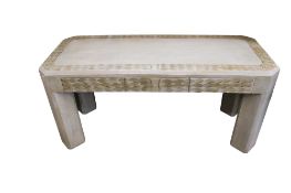 A contemporary grey painted table with leaf or feather decoration.