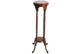 A 20th century mahogany plant stand.