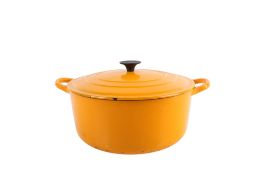 A vintage Le Creuset yellow enamel casserole dish and cover. Size E.