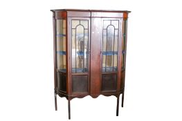 An early 20th century mahogany break front display cabinet.