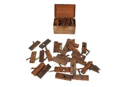A large collection of vintage wooden planes.