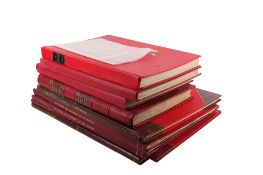 Nine large vintage books.