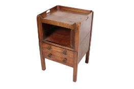 A mahogany tambour front commode cabinet.