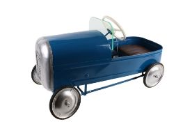 A renovated vintage boat tail pedal car.