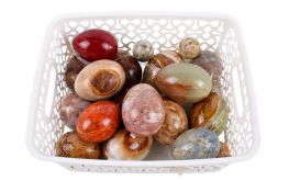 A collection of assorted carved polished natural stone eggs. Max.