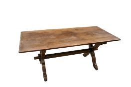 A 20th century oak dining table.