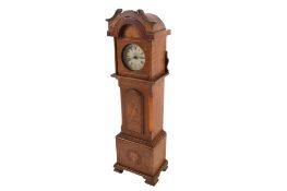 A novelty mantel clock in the form of a longcase clock.