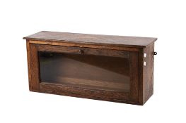 An oak wall mounted display case.