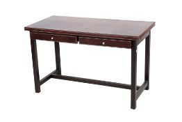 A contemporary brown leather covered table.