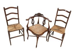 A Victorian mahogany framed corner chair and a pair of oak framed dining chairs.