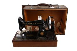 Vintage hand crank Singer sewing machine, cased. S/N EH594453 with some accessories.
