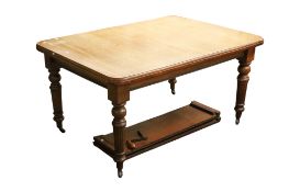 A Victorian mahogany extending dining table.