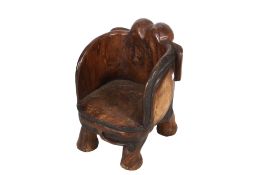 A child's chair carved in the form of an elephant.