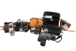 A collection of assorted vintage cine film cameras. Including a Canon, G.B.