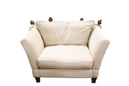 A modern Knowle type drop-arm snug armchair.