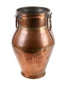 A Victorian beaten copper stick stand.