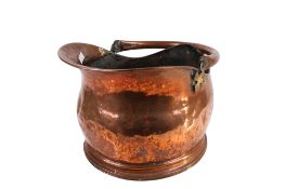 Vintage copper helmet shaped coal scuttle with swing handle.