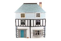 A semi-timber framed doll's house and contents.