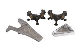 A vintage ashtray, an advertising plaque and a pair of stands.