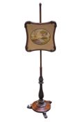 A Victorian mahogany pole firescreen.