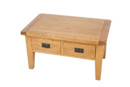 A contemporary light oak coffee table.