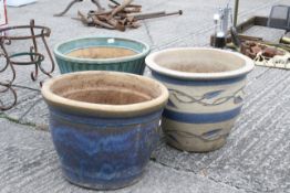 Three large plant pots. Various glazed finishes. The largest H32cm C39cm. All items in this