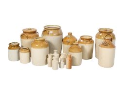 A collection of stoneware storage jars and flagons. Including Greene King & Sons and other examples.