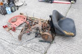 An assortment of vehicle spares. To include a vintage Blackstone tractor seat, various metal springs