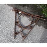 A pair of large wrought iron wall brackets. Possibly for a house porch. H85cm D72cm. All items in