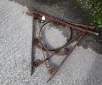 A pair of large wrought iron wall brackets. Possibly for a house porch. H85cm D72cm. All items in