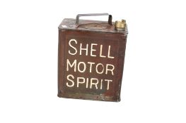 A 1934 Shell Motor Spirit jerry can. Painted red. H28cm W25cm D15cm. All items in this auction are