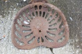 A cast iron Bamford tractor seat. With a cast iron 'Bamford Lion' emblem mounted to the rear,