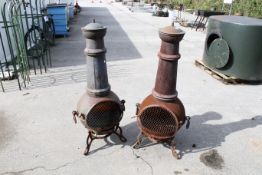 A pair of cast iron garden Chimenea fire pits. H125cm C45cm. All items in this auction are sold as