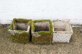 Three square garden planters. With faux brickwork design, two heavily covered in moss. H28cm W32cm