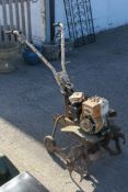 A Norlett petrol rotavator.