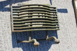 A vintage fire grate and a pair of andirons All items in this auction are sold as seen, We are