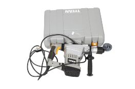An electric Titan 1250W SDS MAX Rotary Hammer drill and chisel. Within heavy duty plastic case, with
