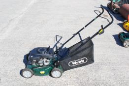 A Webb petrol-powered lawn mower. Model number WER14HP. L60cm (excluding basket and handles) W46cm