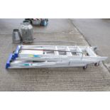 Two Clow aluminium stepladders. Each with handrails and wheels. Erected max height 177cm. All