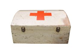 A Red Cross wooden dome top first aid box with tools inside. All items in this auction are sold as