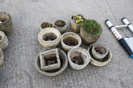 Group of eleven assorted concrete garden plant pots. Max. H28cm All items in this auction are sold
